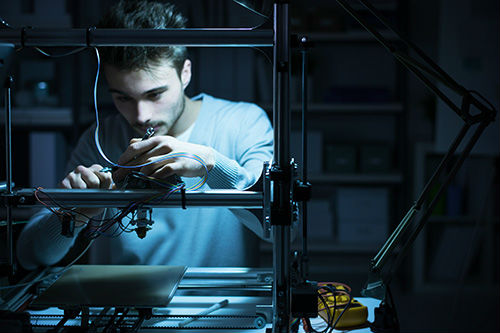 Man using 3D printer